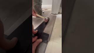 Hammering in a piece of LVP flooring #flooring #construction #daily