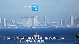 Lihat Singapura dari pinggir pantai Tanjung pinggir Batam Indonesia