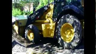 Two John Deere Backhoe