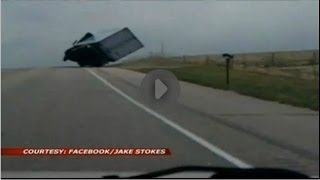 Tractor trailer driver avoids flipping over.