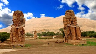 Why are the Colossi of Memnon unique, and why do some say they sing ?