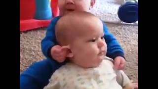 Baby tried to kiss his twin brother very hardly! 😂.mp4