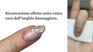 Ricostruzione effetto sotto vetro, cura dell’unghia danneggiata.