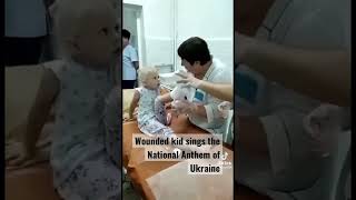 Wounded in the one of the  missile strikes Ukrainian kid sings the National Anthem