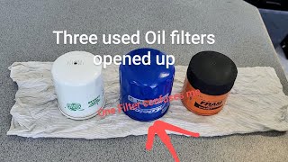 Three used oil filters cut open