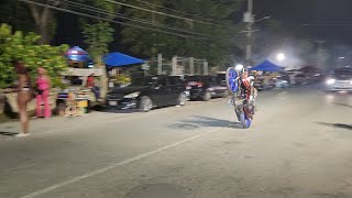 Jamaican Taxi Motorcycle doing wheelie