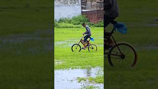 kid playing in the rain in my village #villagelife #kidsplaying #rainyday #shortsfeed #shortdaily