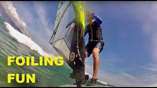 Cheers to Foiling Fun. Windfoiling in Waves at Kanaha, Maui, Hawaii is so much fun.