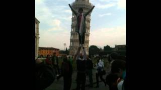 Asiatic athlets at the leaning tower of Pisa