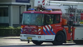 (luchthoorn) Hoogwerker brandweer Oss met spoed naar industrie brand in Oss