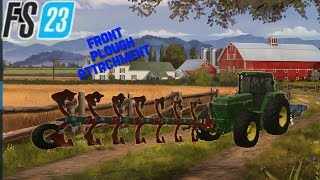 Farming Simulator 23 ( John Deere with front plough attachment in a tranquil countryside)