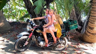 two girls exploring costa rica on a motorbike