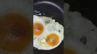 Sunny side up fried eggs #breakfast #ofwkuwait #shortsvideo