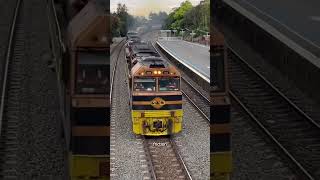 Why is water sprayed on coal transported trains