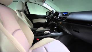 How to use the manual front seat adjustments in the 2015 Mazda3