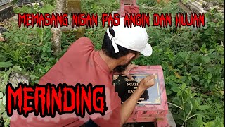 Merinding. masang nisan pas angin dan hujan