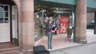 Young piper in Oban