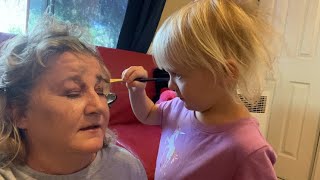 Granddaughter doing my makeup