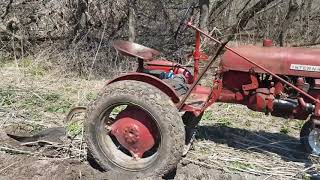 Farmall cub plowing