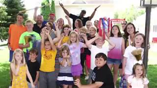 Officers Play Piñata Game with Ronald McDonald House Guests