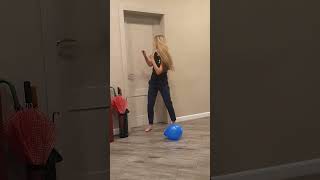 Tanya brings a blue balloon to the dogs