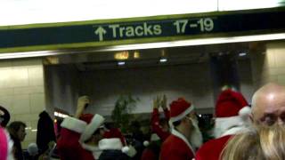 Drunken, dancing Santas in Penn Station