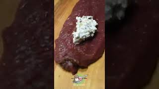 Stuffed venison backstrap with black pepper and herb crust