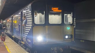 318254 arriving and departing Glasgow Central low level