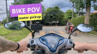 I ride my scooter to get drinking water every week