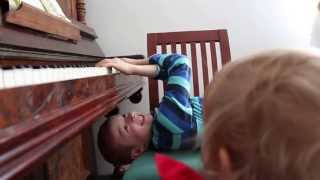 Jacob plays the piano upside down