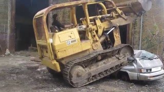 Crushing a Car with a Bulldozer