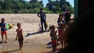 Laos children trying to sell us bracelets on the slow boat to Luang Prabang