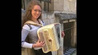 Girl redhead playing accordion italian music maybe