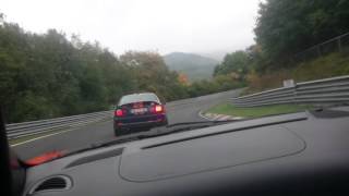 Clarkey orange Porsche Cayman S at Nurburgring