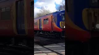 455911 and 455750 pass Barnes Level crossing for Ascot