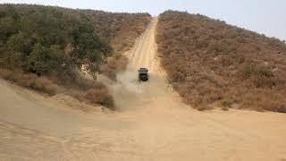 2006 Mitsubishi Montero going offroad up a hollister hill