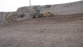 Deere Pull Pans Dumping On a Bench