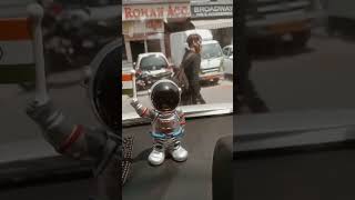 car dashboard astronaut figure