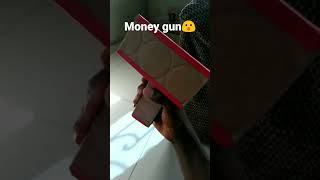 I built this money gun from cardboard