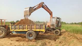 Hitachi excavator amazing work with loading mud to tractor