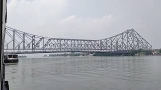 Crossing the Hoogly river on boat and view of Howrah Bridge