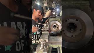 Young Mechanic Rebuilding Car Disc Brake: Interesting Process