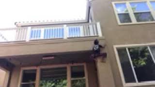 Caught on camera. Kid climbing over wall to get inside the house