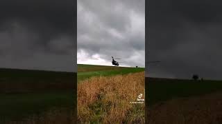 Chinook low level fly past over fields at Salisbury Plain