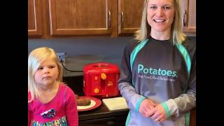 Potato Grower Kathy Michael Sponheim shows how to make french fries in a fryer.