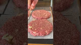 Smoked Cajun Burgers 🍔 Using @tonychacherescreolefoods6156 Burger Marinade for the perfect flavor