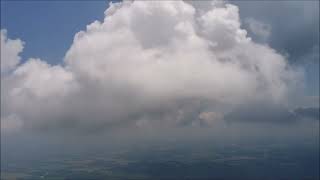 Aerial Cloud Surfing Alongside a Towering Cumulus Cloud