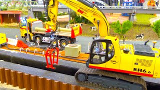 MIND BLOWING RC CONSTRUCTION SITE - HYDRAULIC RC DIGGER - SCANIA RC TRUCKS - INTERMODELLBAU DORTMUND