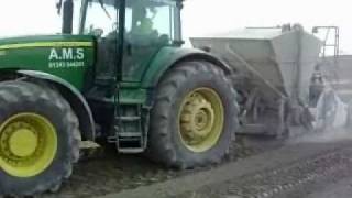 John Deere 8430 pulling soil stablization equipment.wmv