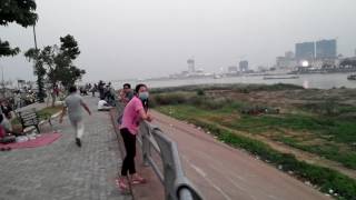 Koh Pich city Diamon city Phnom Penh driving on the street walking   sun set   riverside   Cambodia